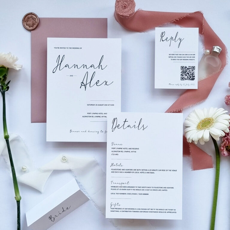 Pink and White Handmade Wedding Stationery laid out.