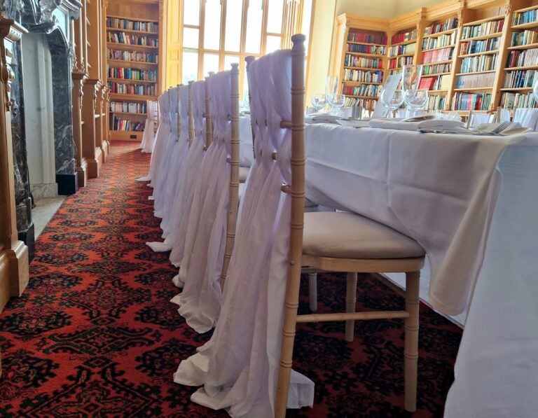 White sashes on chairs by Perfectly Matched Venue Styling