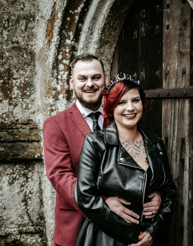 Bride & Groom smiling outside church by Viking Photography