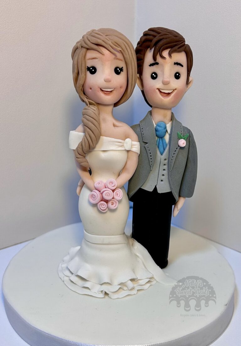 Icing bride & groom by Nellys Sweet Treats. Bespoke Cakes Sheffield