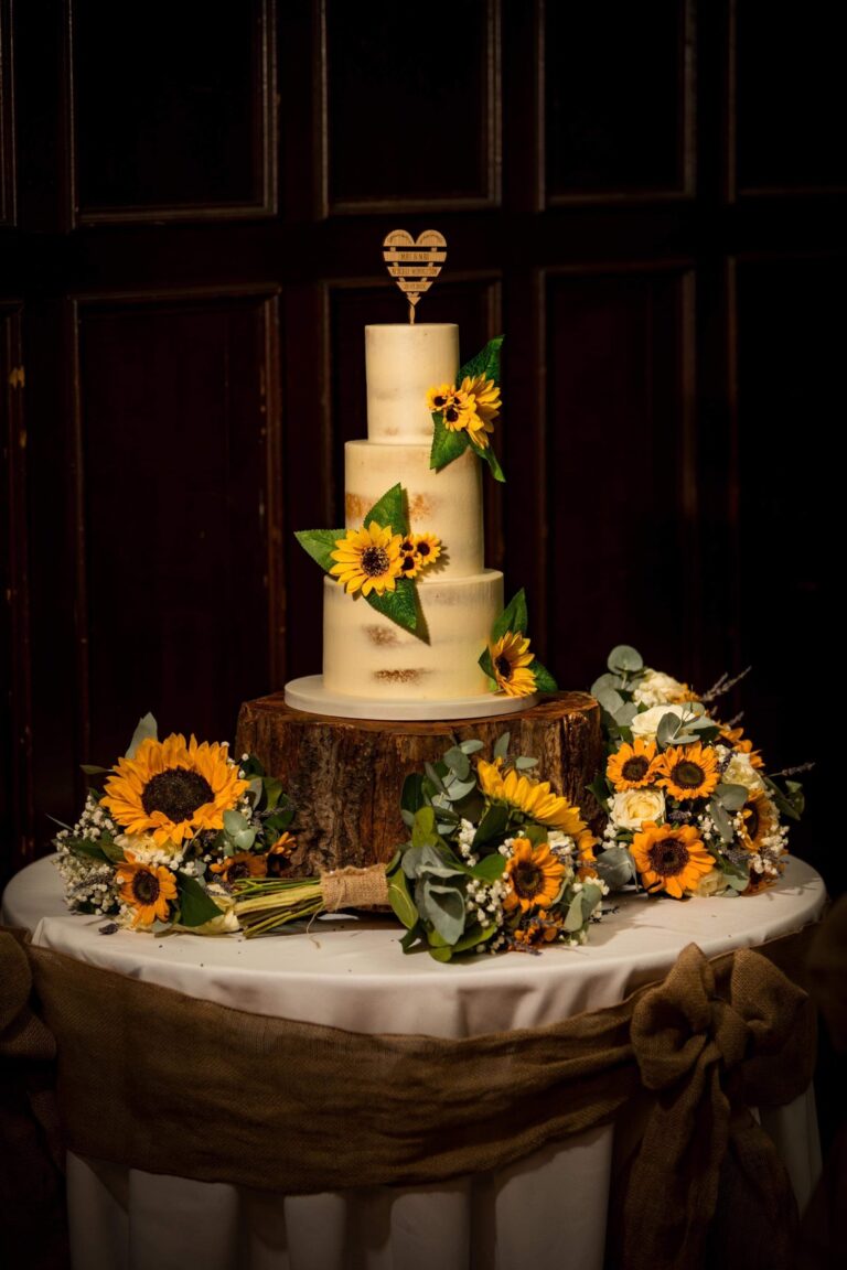 Wedding Cake decorated with sunflowers by Nellys Sweet Treats. Bespoke Cakes Sheffield