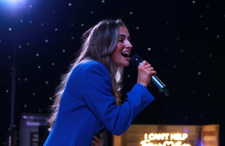 Sally Hall Vocals singing at an event