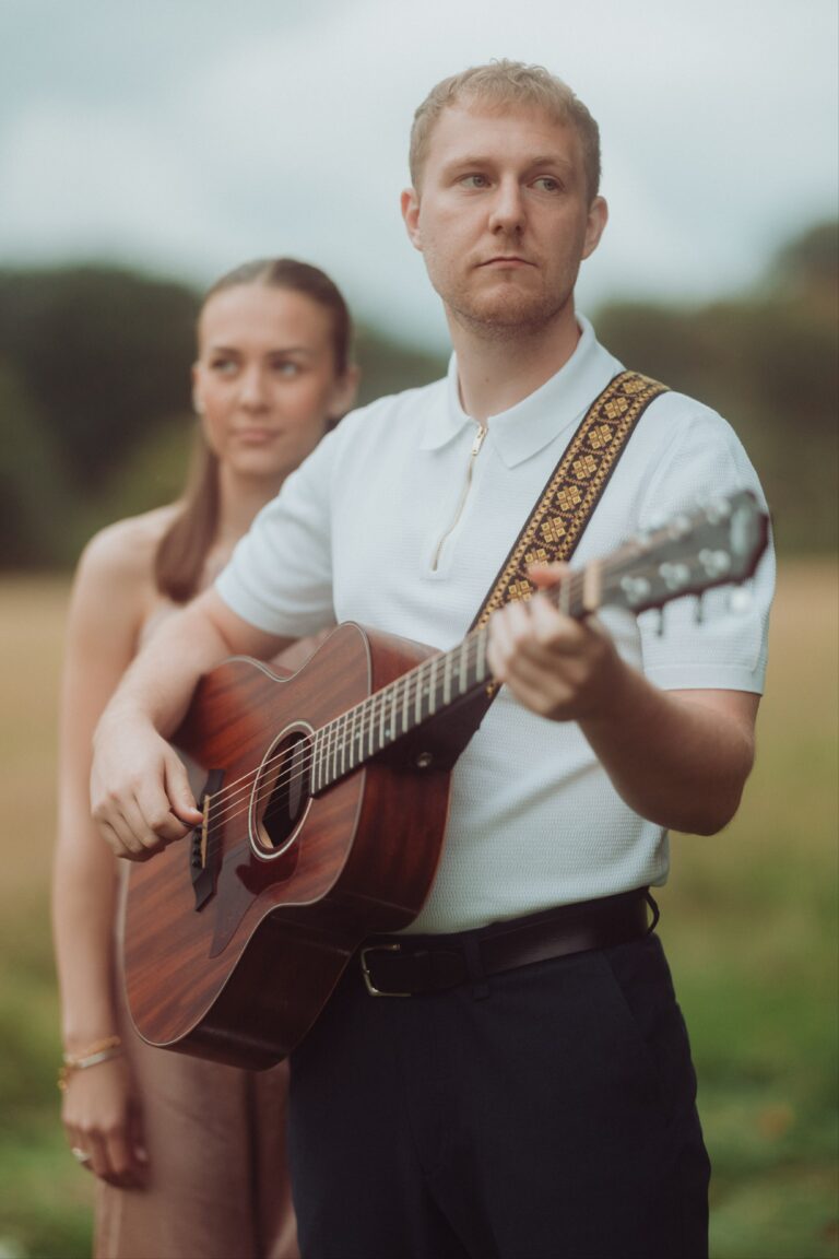 Lockstep Duo performing with guitar