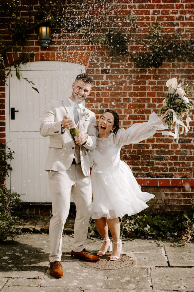 Couple just married celebrating. Taken by Kat Shot This. 